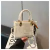 Venta al por mayor transfronteriza 2026 Modelo nuevo Bolso de mano pequeño para mujer, Bolso cuadrado versátil casual para el hombro, Bolso cruzado simple para el día a día