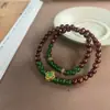 Pulsera Estilo Círculo Doble de Sándalo Rojo con Trébol de Cuatro Hojas Calcedonia Verde Pulsera de la Suerte Sándalo Rojo Pulsera Creativa Cultural de Juego Cuentas de Oración