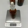 Botella de aceite esencial de 200 ml, botella de prueba de subenvasado de perfume de té, botella de envasado cosmético de 150 ml, botella de vidrio marrón