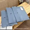 Bolsa de Embalaje de Tela No Tejida Morada Bolsa de Embalaje para Tienda de Ropa Bolsa a Prueba de Polvo Logo Personalizado Stock Listo Embalaje con Botón de Presión