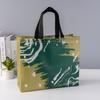 En stock venta al por mayor película de impresión a color impermeable de alta gama bolsa de ropa no tejida bolsa de regalo de película de color entrega rápida