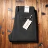 Estación europea otoño e invierno gruesos lujo ligero algodón puro lana pantalones de hombre lana cepillada rectos holgados pantalones casuales de negocios