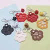 Venta Caliente Bolso de Cosméticos de Piel Sintética para Pelo de Mascota Llavero Portátil con Huella de Pata Colgante Etiqueta Conmemorativa para el Pelo Etiqueta para Mascota Gato y Perro