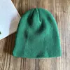 Gorro frío de lana gruesa y cálida de moda retro de color puro para otoño e invierno, moderno para hombres y mujeres, versátil y popular para parejas de punto de calle.