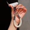 Correa de anillo superestilosa con bloques de color, duradera y resistente con un gancho de metal, un cordón para teléfono anti-pérdida para mujer para ir de compras