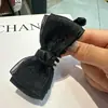 Exquisito pasador de pelo estilo coreano con pequeño lazo y pedrería, pasador banana accesorio para el cabello, pasador de pelo elegante y versátil
