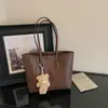 Nueva bolsa de hombro retro minimalista 2026 para mujer, gran capacidad, casual, para ir al trabajo, bolso de mano con textura tejida