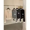 Té verde limón otoño estilo coreano simple versátil ajustado bloques de color dos piezas cuello en V manga larga camiseta para mujer 11058