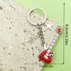 Diseño Creativo Plata Vintage Saxofón Cinta Musical Llavero Transfronterizo Más Vendido Colgante de Bolsa Pequeño Accesorio
