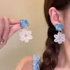 Pendientes de flor azul estilo vacación de verano en la playa, diseño exquisito y único, pendientes versátiles que adelgazan el rostro