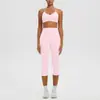 Conjunto esportivo de yoga com sutiã de ioga sem costura de novo estilo transfronteiriço com acolchoamento embutido, alta elasticidade, secagem rápida, e calça capri para corrida