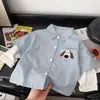 Nueva camisa a rayas de dos piezas falsas para niños, camisa de otoño con cuello vuelto de cachorro, versátil camisa casual de manga larga de estilo coreano de moda