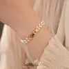 Pulsera de perlas con cierre de zirconita chapado en oro real de 14 quilates, pulsera de muñeca de lujo discreto de nicho, joyería personalizada y elegante al por mayor