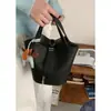 Bolsa de cesta de verduras portátil de verano para mujer 2025 nueva moda nicho bolso cubo bolso bandolera simple una generación de pelo