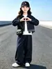 Conjunto de mezclilla estilo coreano para niñas, nueva colección otoño 2026, con una camisa de retazos a cuadros y pantalones de pierna ancha