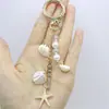 Moda Europea y Americana Geométrico Forma Especial Perla de Imitación con Cuentas Colgante Estilo Marino Concha Pequeña Estrella de Mar Colgante Llavero Cadena para Colgar