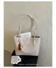 Bolso de mano tejido de alta gama de nicho transfronterizo para mujer, nuevo de verano 2026, gran capacidad, con cuentas, para ir al trabajo, de un solo hombro