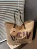 Otoño e Invierno 2025 Bolso de Lona Nuevo Moda Bolso de Mano para Estudiante Femenina Bolso de Hombro Lindo para Viajes Diarios Bolso Tote