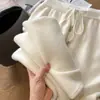 Estilo de otoño e invierno: Pantalones de lana virgen 100% australiana de tiro alto y pierna ancha para mujer, con una mezcla de lana suave y cómoda como una nube, y un diseño recto y largo.