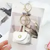 Bolsa de Moedas Criativa para Guardar Fones de Ouvido Carteira Pequena Chaveiro Pingente de Bolsa Couro Mini Bolsa Pequena de Armazenamento