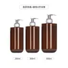 Em estoque 250ml frasco plástico PET marrom de ombro reto e fundo redondo, frasco de shampoo fosco de grande capacidade 500ml