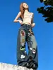 Trendy Carp tiene en stock jeans bordados de dibujos animados para mujer, nuevo estilo de otoño, de cintura alta, holgados, adelgazantes, de pierna ancha, largos hasta el suelo