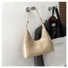 Bolso bandolera casual de cuero brillante para debajo del brazo para mujer 2026 nuevo estilo charol moderno de lujo ligero de un solo hombro bolso de mano bolso baguette