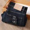 Estación europea de alta gama jeans blancos para hombre otoño e invierno gruesos clásicos casuales elásticos holgados rectos pantalones lavados