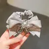 Exquisito y de alta gama, estilo coreano, scrunchie de satén con lazo de cristal, diseño de nicho, banda elástica alta para el cabello para mujeres