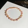 [Cadena de Diamantes Arcoíris] Pulsera de extracción de zircón trenzado en cruz, una pulsera lujosa y de alta gama, una pieza de joyería delicada y de moda