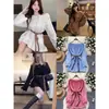 Suéter de punto estilo coreano para mujer con ribete de encaje asimétrico, que presenta un look otoñal suave, casual y dulce, con un diseño de hombros descubiertos y un estilo holgado de jersey.