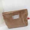 Bolsa de cosméticos de lona de pana pequeña fresca de gran capacidad portátil color sólido almacenamiento simple clutch cosmético al por mayor
