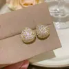 Pendientes de gota de agua de circonita súper brillantes, exquisitos y de moda, pendientes de temperamento y personalidad, sensación de lujo ligero de alta gama, diseño de nicho, adornos para la oreja