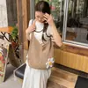 Bolsa de mão tecida para férias casuais transfronteiriças, bolsa tote estilo despojado para o dia a dia, bolsa de ombro/transversal vazada para praia à beira-mar