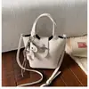 Bolso cruzado coreano de nicho lindo, bolso cubo vintage nuevo, bolso de mano, bolso de hombro versátil y moderno para el día a día del commuter