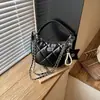 Bolso estilo Chanel de estrella y luna para mujer, nuevo modelo 2026, bolso de axila de nicho de lujo ligero, bolso de cadena acolchado, bolso de mano y bolso cruzado