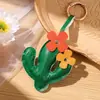 Encantos creativos de cuero con temática de planta de cactus de gran venta, accesorios para bolsos y ropa, y llaveros - al por mayor