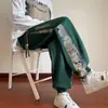 Pantalones Casuales para Hombre Transfronterizos Sueltos de Marca de Moda Pantalones Largos Estampados para Hombre Juventud Estilo Hong Kong Modernos Pantalones Versátiles Estilo Chino