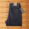 Nueva colección otoño e invierno 2026: forrados de polar, gruesos, texturizados, de sarga, elásticos, pantalones largos, de alta gama, corte holgado, pierna recta, pantalones casuales versátiles para hombre