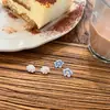 Pendientes pequeños frescos de aguja de plata 925 azul Mori blanco temperamento simple moda corazón de niña pendientes de flor venta al por mayor mujer