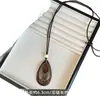 Otoño/Invierno 2026 Nuevo Estilo Étnico Retro Conjunto de Cuatro Collares Nudo de Lazo Cadena Larga de Lujo Ligero con Cadena para Suéter