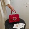 Bolsa de poá de nicho de alta qualidade para mulheres, nova moda 2026, bolsa transversal versátil, bolsa de mão requintada, bolsa Kelly