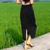 Falda midi de lunares blancos para mujer, nuevo estilo de verano 2026, moderna y versátil, de cintura alta, adelgazante, con abertura y corte al cuerpo