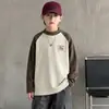 Ropa interior térmica de forro polar para niños Otoño/Invierno 2026 Nuevo estilo Ropa infantil Otoño Camiseta de manga larga de cuello alto Top elegante