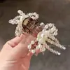 Nuevo Pasador Pequeño de Perla y Moño para el Cabello de Mujer Primavera/Verano 2026, Accesorio de Cristal de Lujo Ligero para Peinados Semirecogidos, Realza la Elegancia