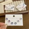 Joyería de Diamantes con Flor de Ciruelo Brillante de Nuevo Estilo, Diseño Geométrico Irregular Simple, Sensación de Lujo Ligero y Gama Alta, Múltiples Estilos de Aretes