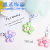 Llavero creativo con forma de flor pequeña de color caramelo fresco y pétalos brillantes, bonito y dulce colgante de bolso con forma de corazón para niña.