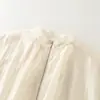 Venta al por mayor para comercio exterior 2026 Moda europea y americana holgada con cremallera cuello alto plisada chaqueta bomber para mujer M87076