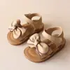 Sandálias de comércio exterior 2025 verão novas sandálias para meninas sandálias coreanas com laço para bebê sapatos de praia sapatos de princesa para crianças