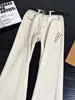 Jeans de color sólido, corte inclinado, bordados, color blanco roto, pantalones unisex de pierna recta ligeramente acampanada, largos, de tendencia, high-street, lavados